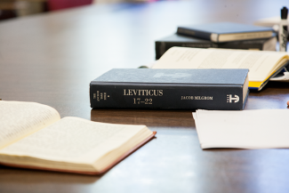 Religious texts on the table during a graduate seminar