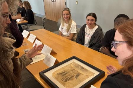 Students showcasing their exhibit contributions.